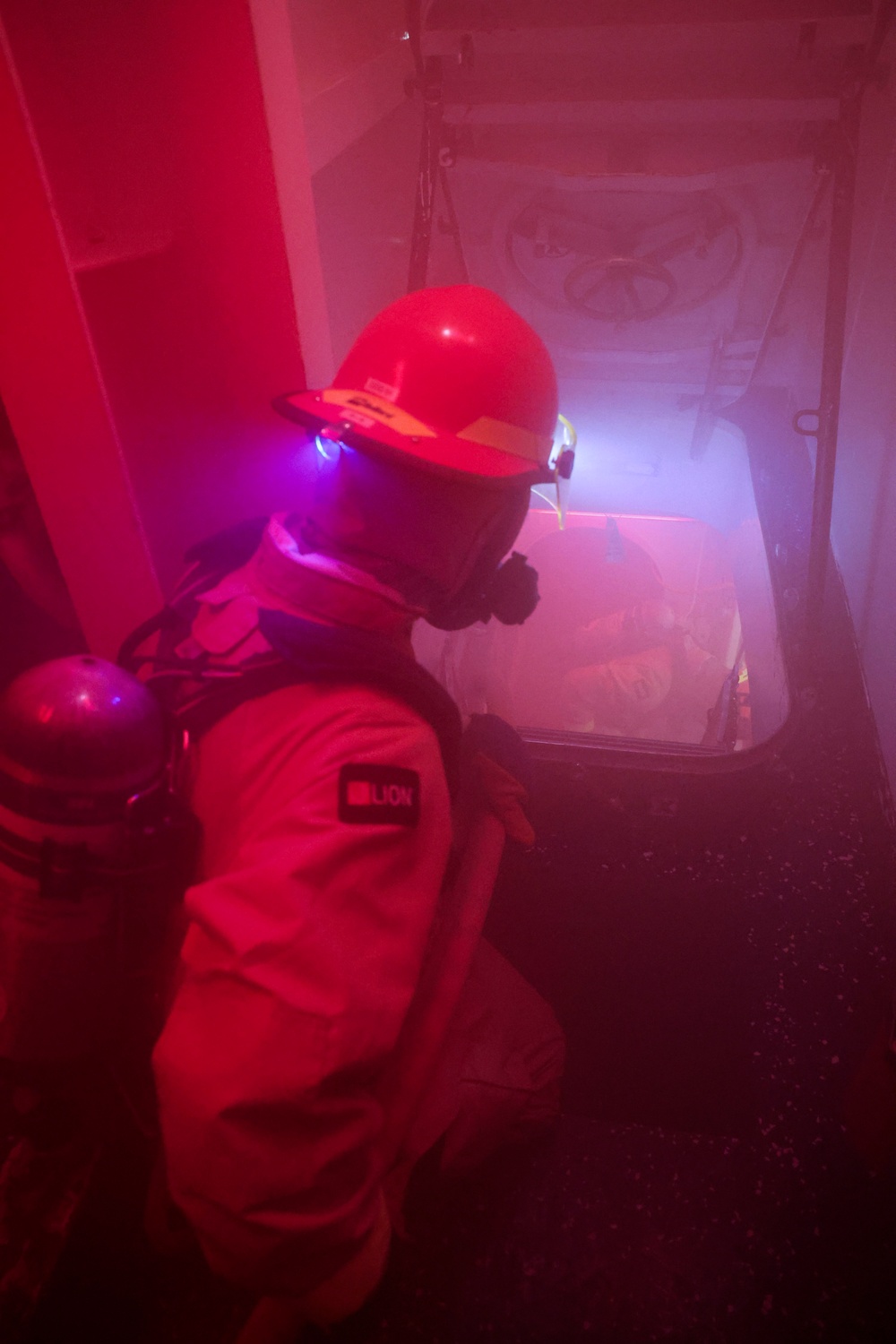 USS Bulkeley (DDG 84) Sailors respond to a simulated class bravo fire