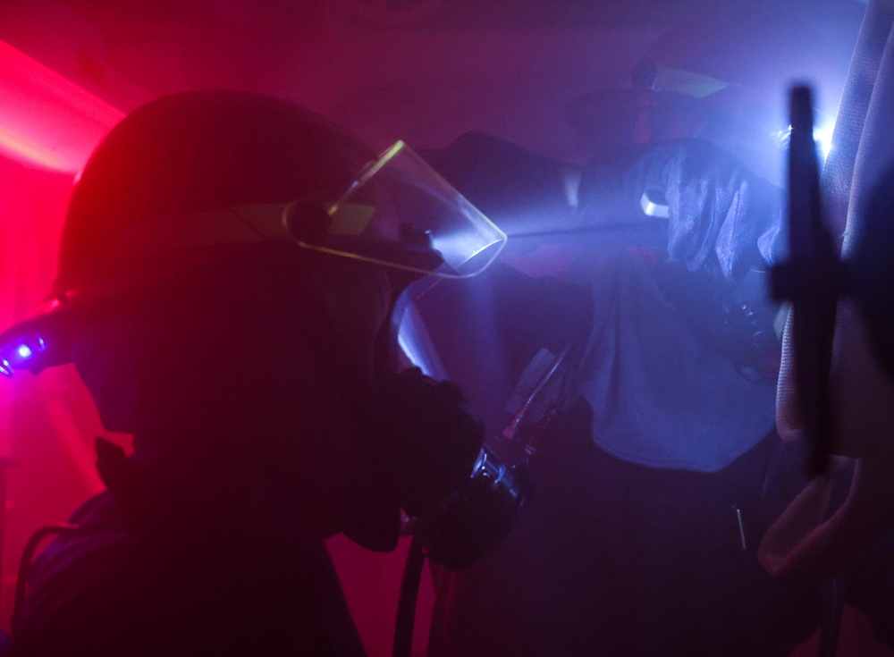 USS Bulkeley (DDG 84) Sailors respond to a simulated class bravo fire during a damage control drill