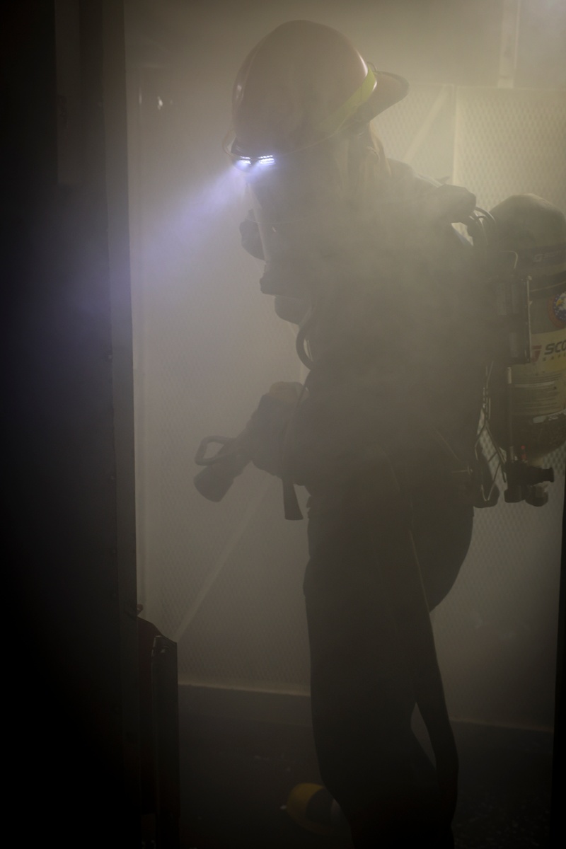 USS Bulkeley (DDG 84) Sailors operate firehoses and respond to a simulated class bravo fire