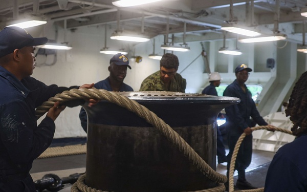 USS Iwo Jima Sailors Heave In Lines During Sea and Anchor Evolution