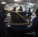 USS Iwo Jima Sailors Heave In Lines During Sea and Anchor Evolution