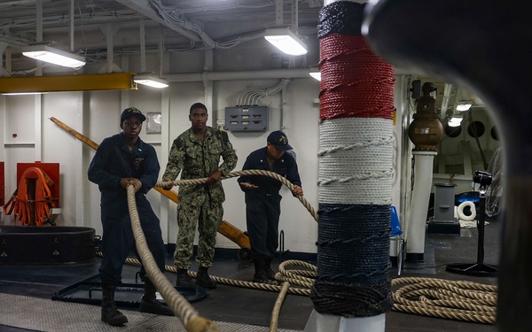 USS Iwo Jima Sailors Heave In Lines During Sea and Anchor Evolution