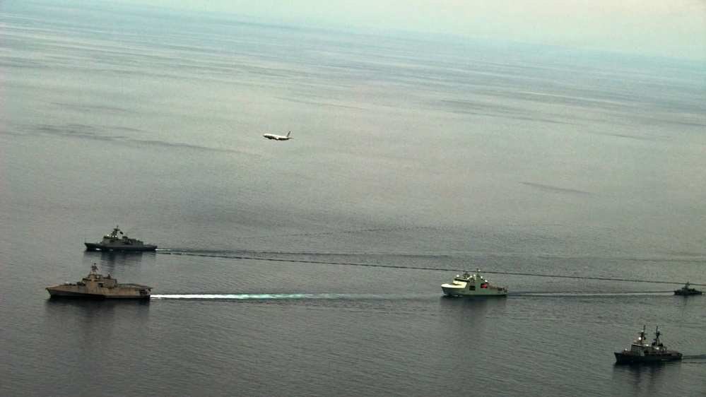 U.S. Navy, Philippine Navy, Japanese Maritime Self-Defense Force, and Royal Canadian Navy sail in formation