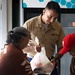 Navy and Marine Corps Volunteer at Small Things Market in Philadelphia