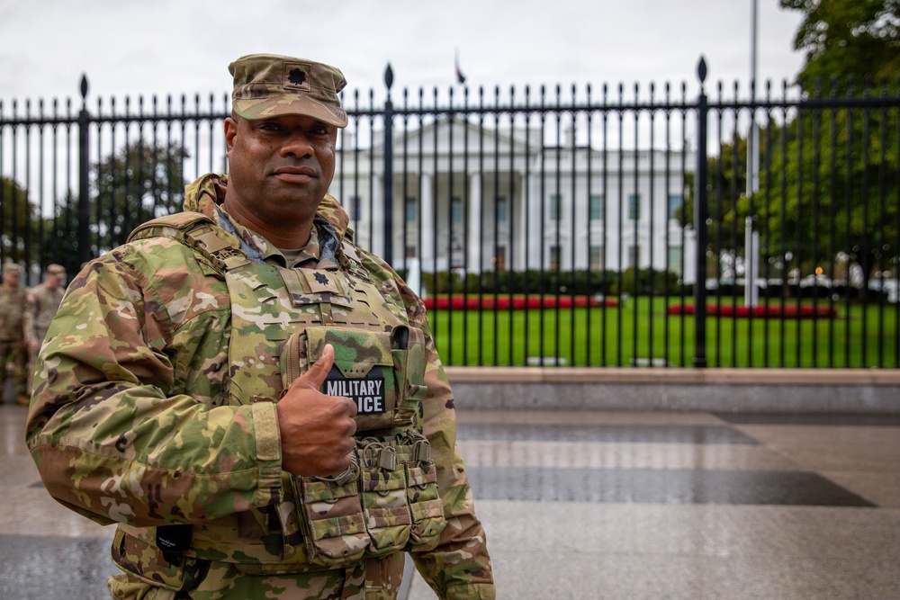 Joint Task Force Magnolia Commander, Lt. Col. Steven Jackson, gives a thumbs up in front of the White House