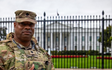 Joint Task Force Magnolia Commander, Lt. Col. Steven Jackson, gives a thumbs up in front of the White House