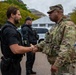 Joint Task Force Magnolia Commander, Lt. Col. Steven Jackson, shakes hands with a Secret Service Officer
