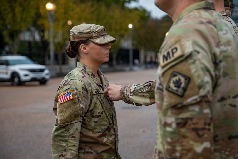 U.S. Army Sgt. Kaylyn Runnels, 112th Military Police Battalion, MSNG, is promoted to the rank of Staff Sgt.