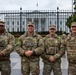 Leadership from Task Force Magnolia take a photo in front of the White House