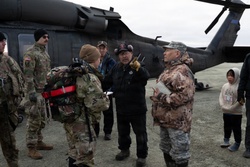 AKOM members conduct damage evaulations in western Alaska as relief efforts transition to recovery operations [Image 1 of 4]