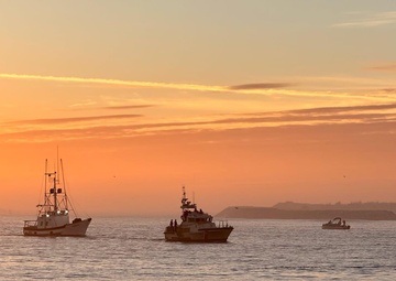 A U.S. Coast Guard 47-foot Motor Lifeboat crew from Coast Guard Station Coos Bay tows a 55 foot fishing vessel near Coos Bay