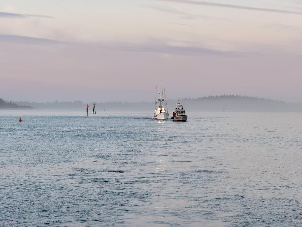 A U.S. Coast Guard 47-foot Motor Lifeboat crew from Coast Guard Station Coos Bay tows a 55 foot fishing vessel near Coos Bay