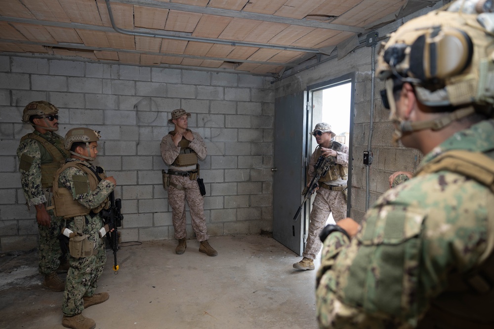 U.S. Navy Sailors and Marines perform Close Quarters Battle Drills
