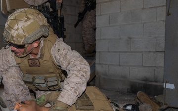 U.S. Navy Sailors and Marines perform Close Quarters Battle Drills