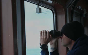 A Coast Guard Cutter Forest Rednour crew member stands watch off southwest border