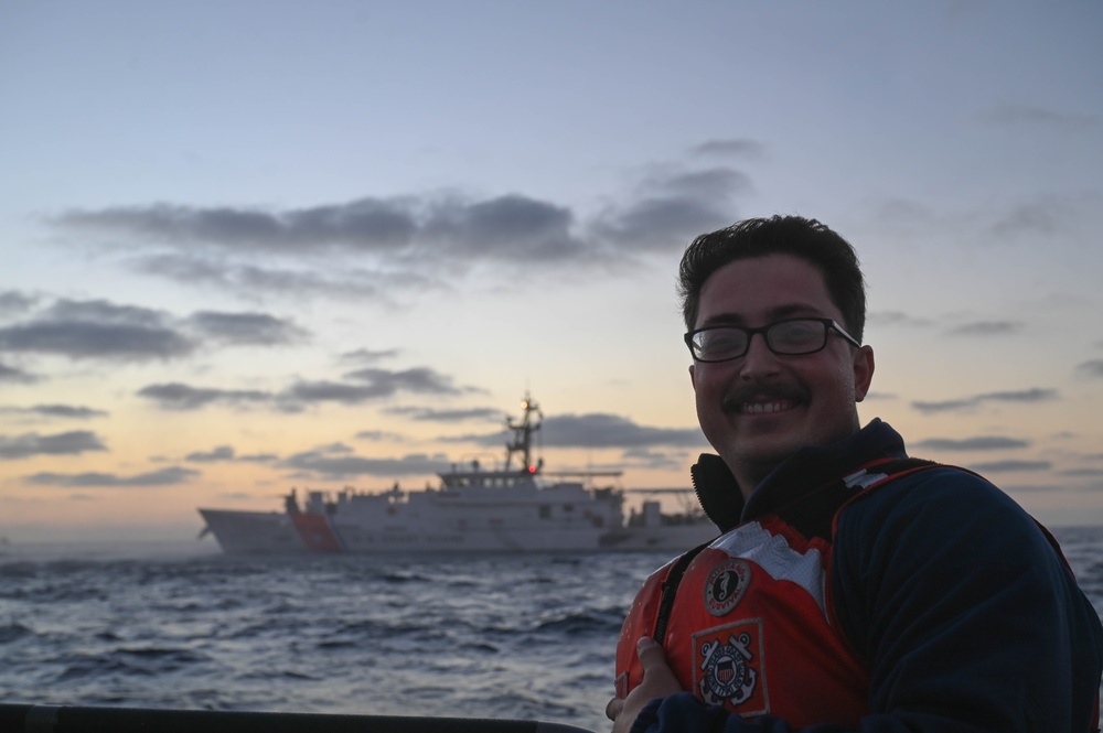 A Coast Guard Cutter Forrest Rednour crew member stands for a photo during fast-rope training