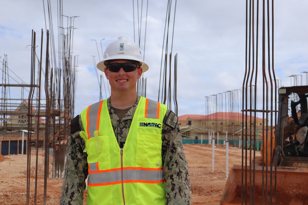 A Civil Engineering Corps Office Tours a Project Site
