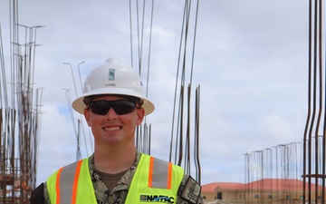 A Civil Engineering Corps Office Tours a Project Site