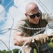 346th AEW lay concertina wire