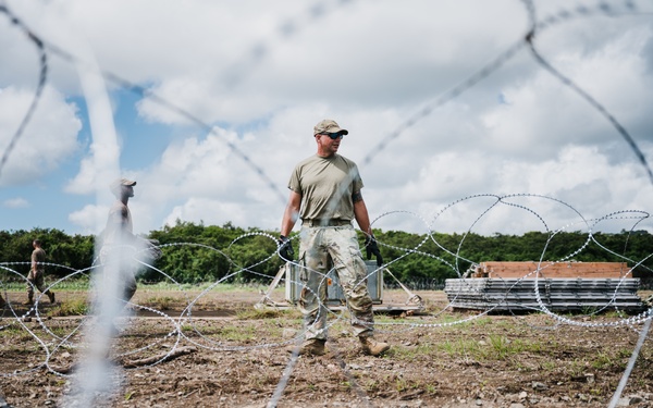 346th AEW lay concertina wire