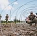 346th AEW lay concertina wire