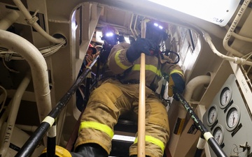 Initial attack team in a Damage Control Drill aboard the USS Paul Ignatius (DDG 117)
