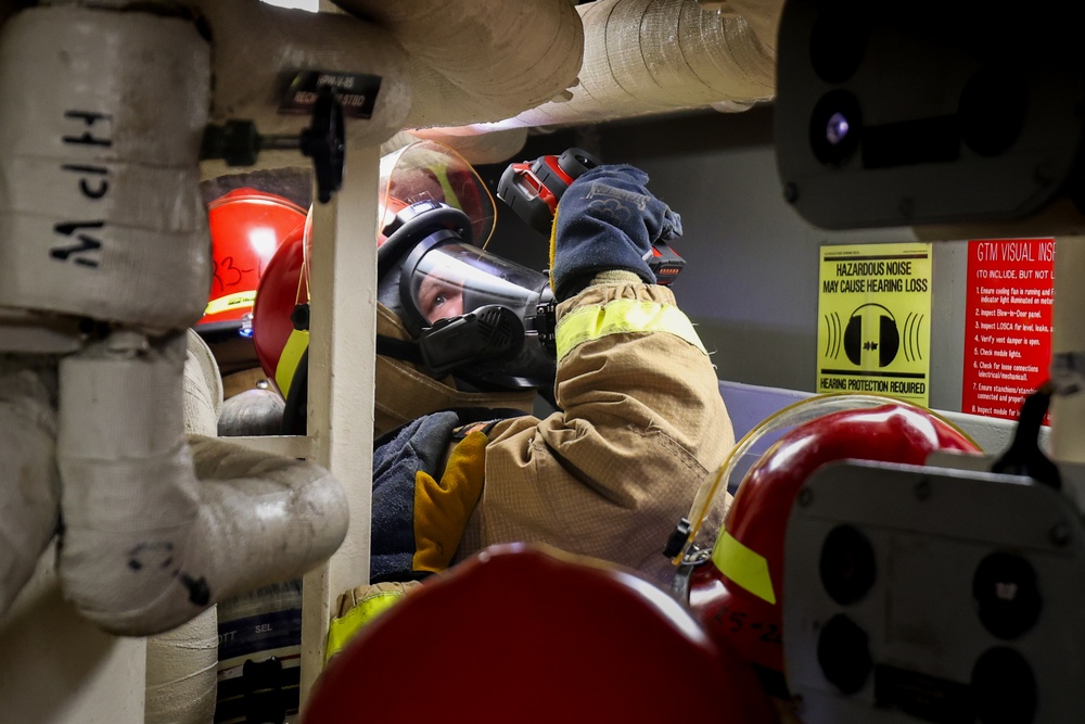 Initial attack team in a Damage Control Drill aboard the USS Paul Ignatius (DDG 117)
