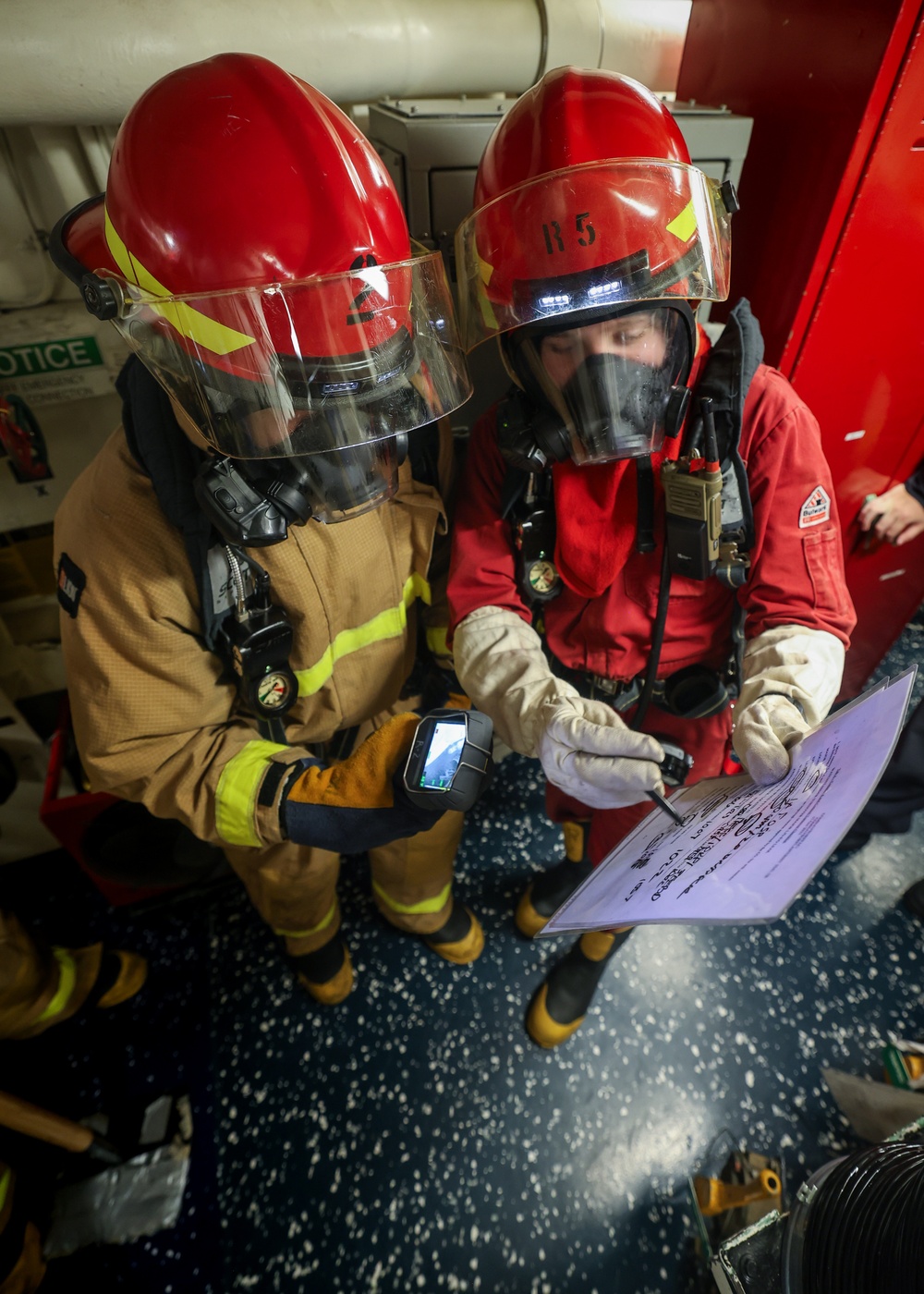 Initial attack team in a Damage Control Drill aboard the USS Paul Ignatius (DDG 117)