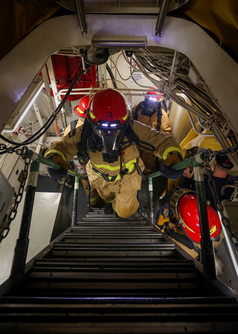 Initial attack team in a Damage Control Drill aboard the USS Paul Ignatius (DDG 117)