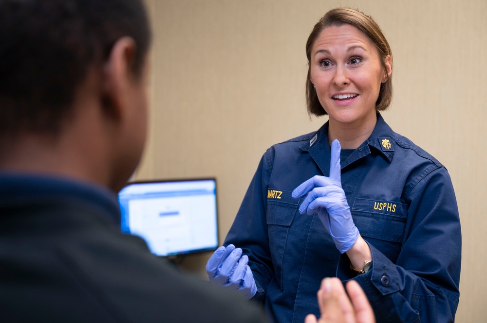 Lt. Amber Martz conducts a physical Lt. Amber Martz conducts a physical