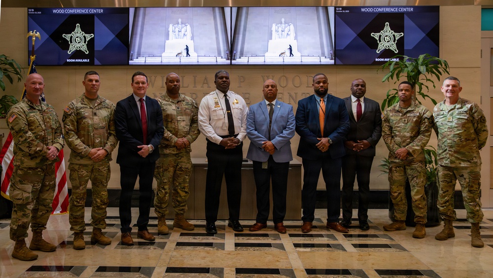 U.S. Secret Service members take a photo with Mississippi Army National Guard Soldiers