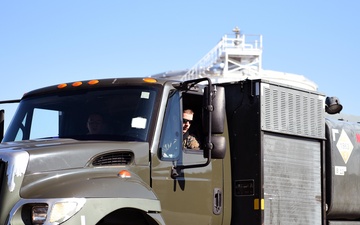 An Airman and a Marine practice driving the R-11 aircraft refueler