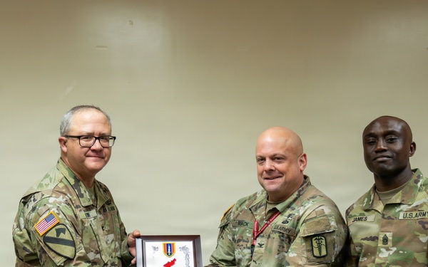 1st Signal Brigade Presents Plaque of Appreciation to Sgt. Shin Woo Kim Health Clinic