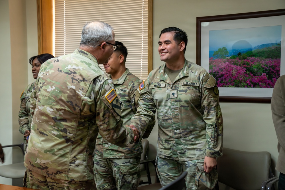 1st Signal Brigade Presents Plaque of Appreciation to Sgt. Shin Woo Kim Health Clinic