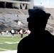 Navy Recruiter Looks across Field
