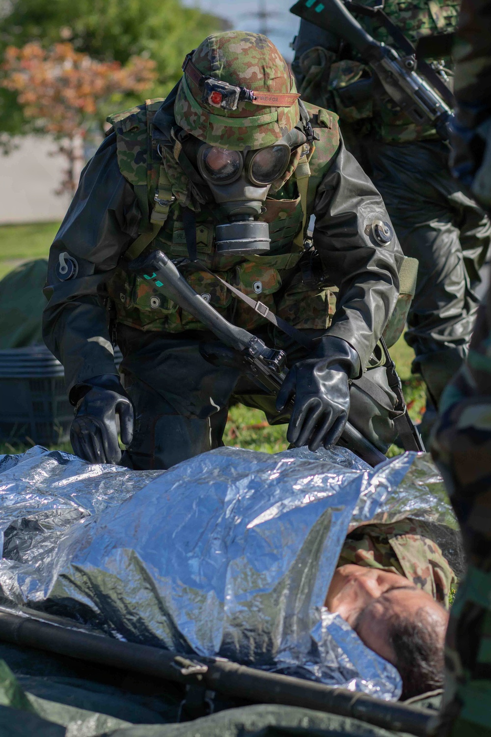U.S. Marines and JGSDF members respond to a simulated CBRN attack during exercise Active Shield 26