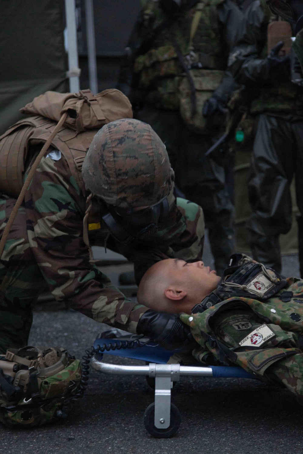 U.S. Marines and JGSDF members respond to a simulated CBRN attack during exercise Active Shield 26 U.S. Marines and JGSDF members respond to a simulated CBRN attack during exercise Active Shield 26
