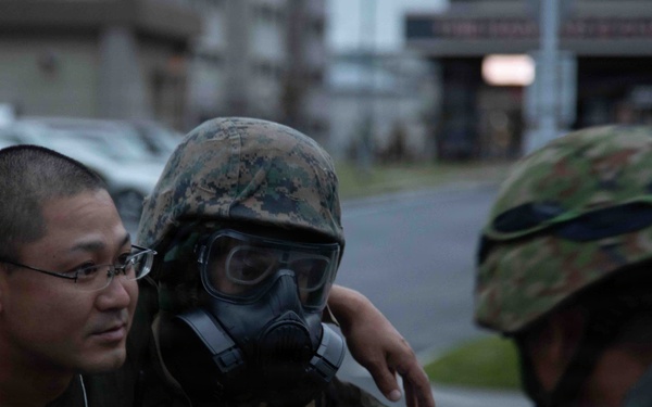 U.S. Marines and JGSDF members respond to a simulated CBRN attack during exercise Active Shield 26