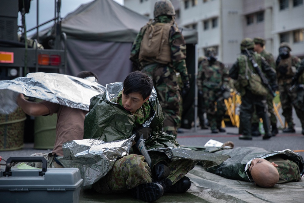 U.S. Marines and JGSDF members participate in simulated CBRN casualty care during exercise Active Shield 26