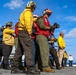 USS Iwo Jima Sailors and U.S. Marines Conduct An Aviation Training Team Drill on the Flight Deck