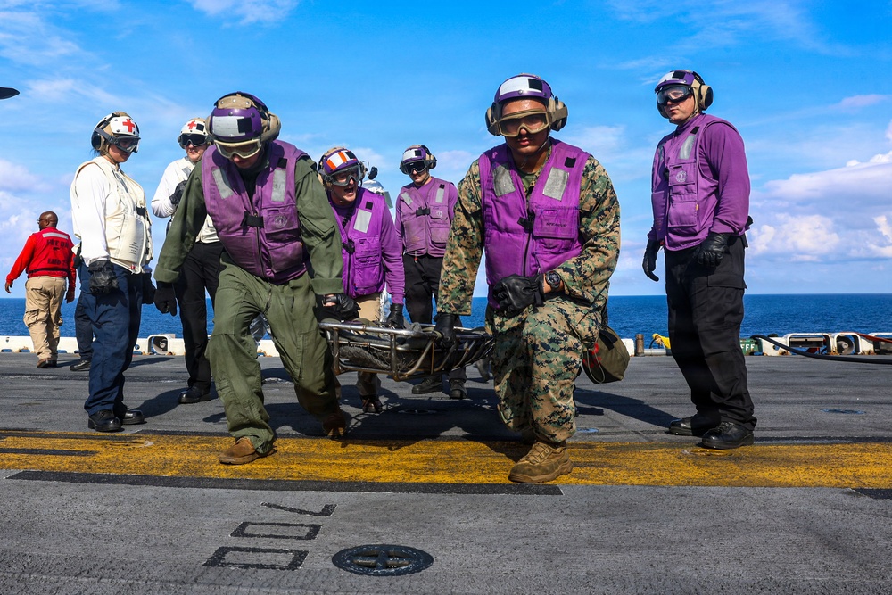 USS Iwo Jima Sailors and U.S. Marines Conduct An Aviation Training Team Drill on the Flight Deck