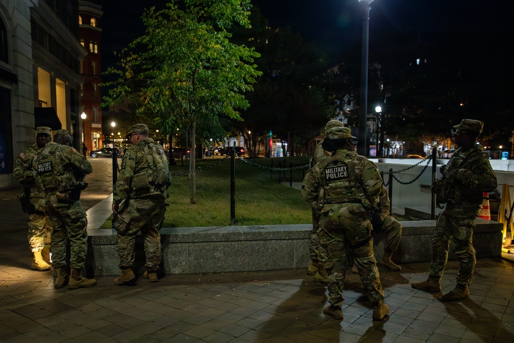 Mississippi Army National Guard Soldiers on patrol at night in Washington, D.C. Mississippi Army National Guard Soldiers on patrol at night in Washington, D.C.