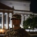 A Mississippi Army National Guard Soldier on patrol at night in Washington, D.C.