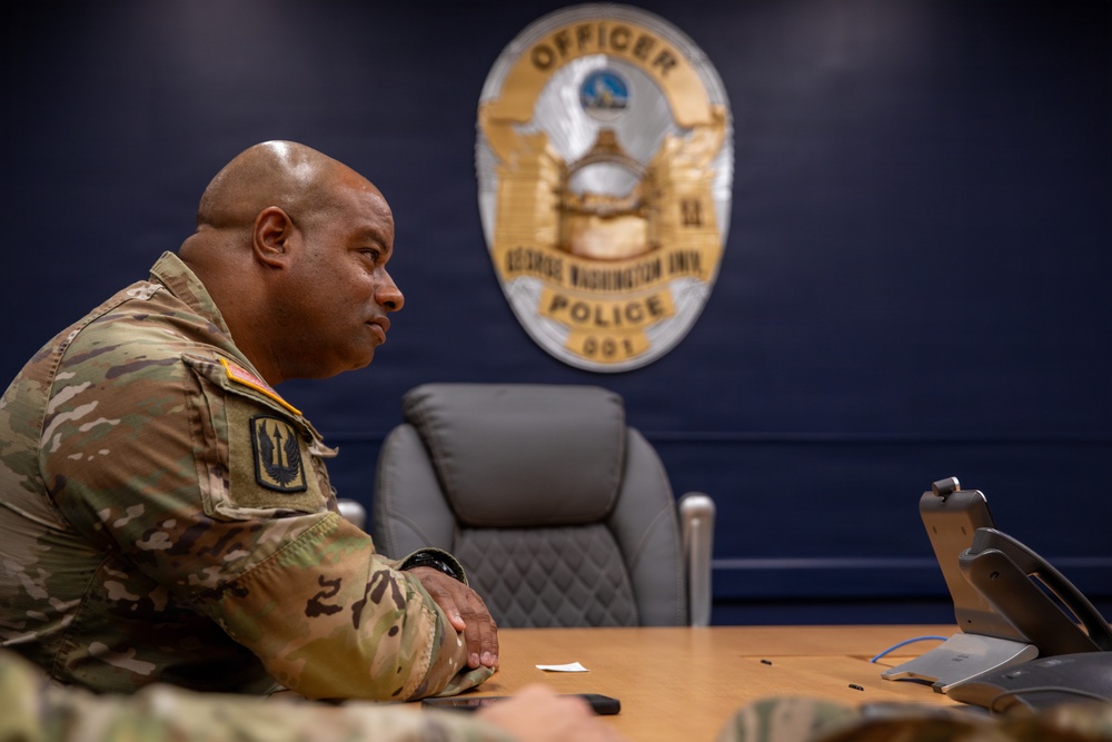 Lt. Col. Steven Jackson in a meeting at the George Washington University Police Department Lt. Col. Steven Jackson in a meeting at the George Washington University Police Department