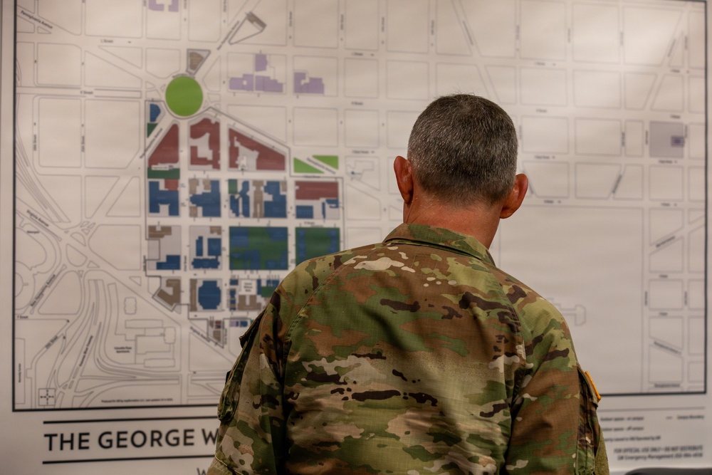 Maj. Robert Gray looks at a map of the George Washington University campus Maj. Robert Gray looks at a map of the George Washington University campus