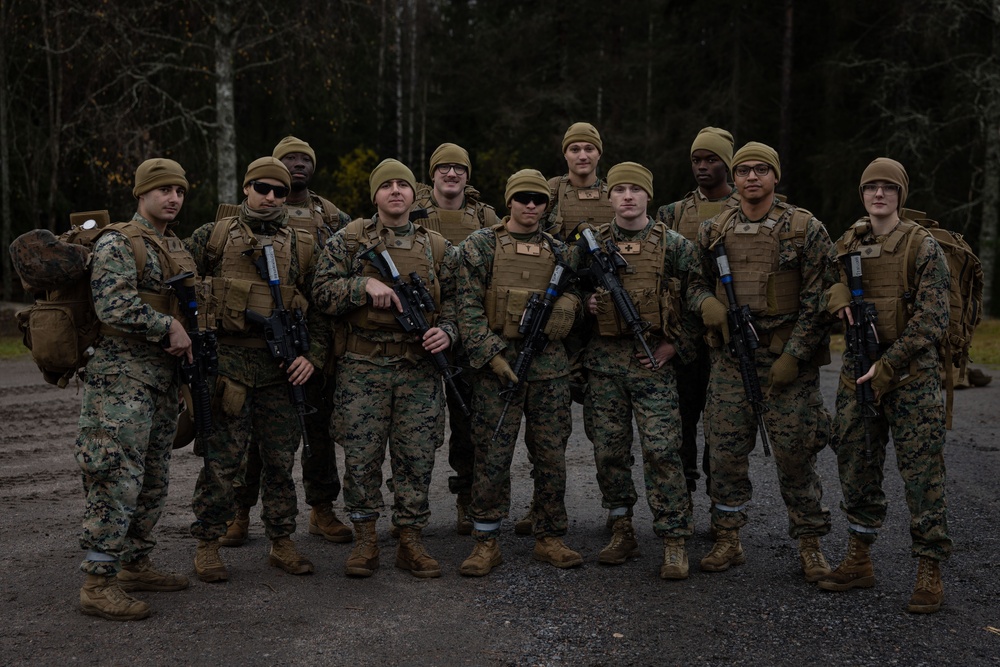 Combat Logistics Battalion 6 Corpsmen pose for photos before a live-fire range 