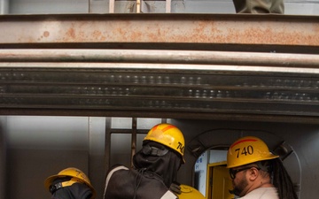 Ronald Reagan Sailors Install Door