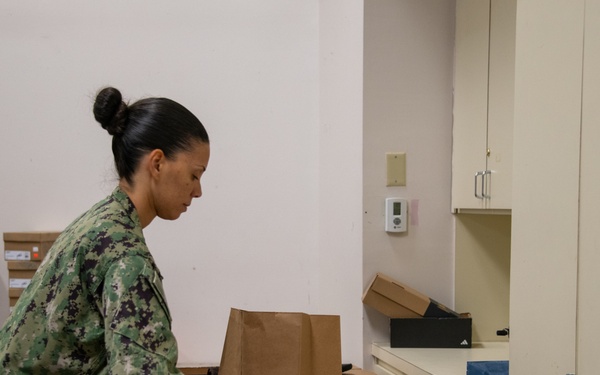Sailors Utilize Chapel Closet
