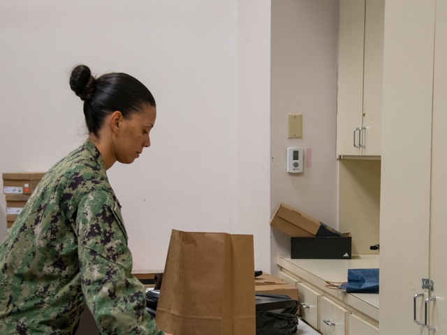 Sailors Utilize Chapel Closet