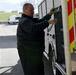 A rescue worker opens a rescue vehicle side compartment